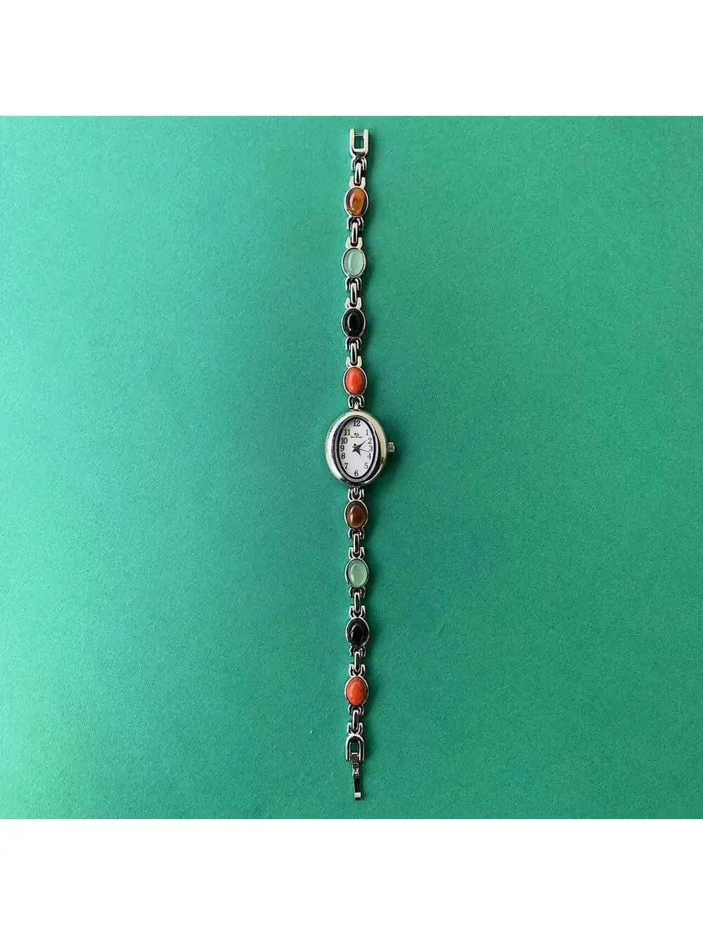 Y2k style silver tone quartz watch with glass multi color jade stone opal